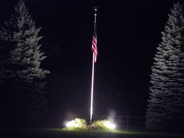 American flag with spotlights